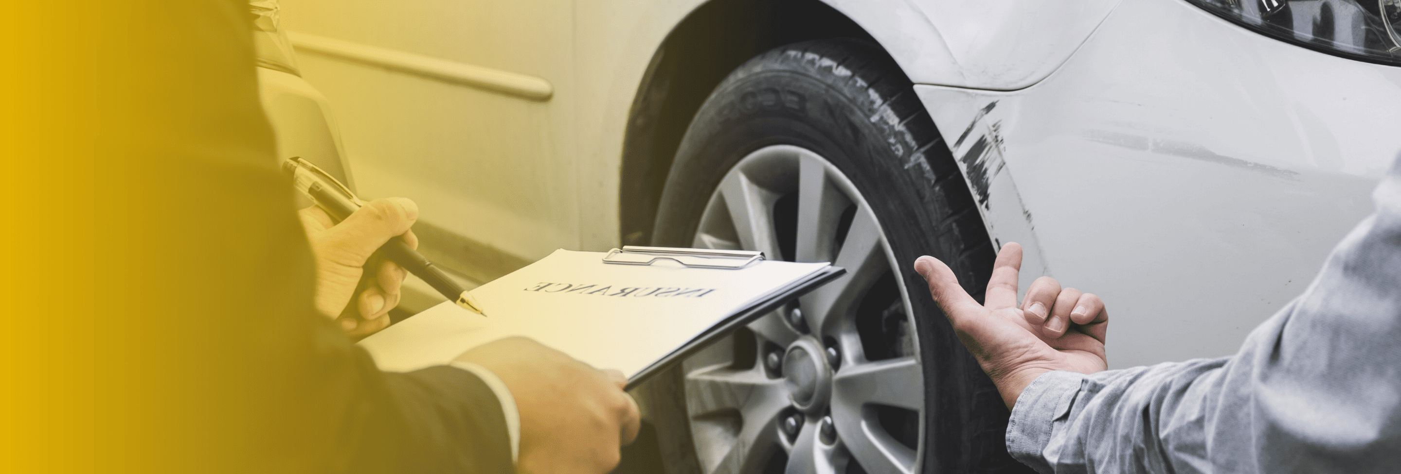 Insurance agent assessing vehicle damage