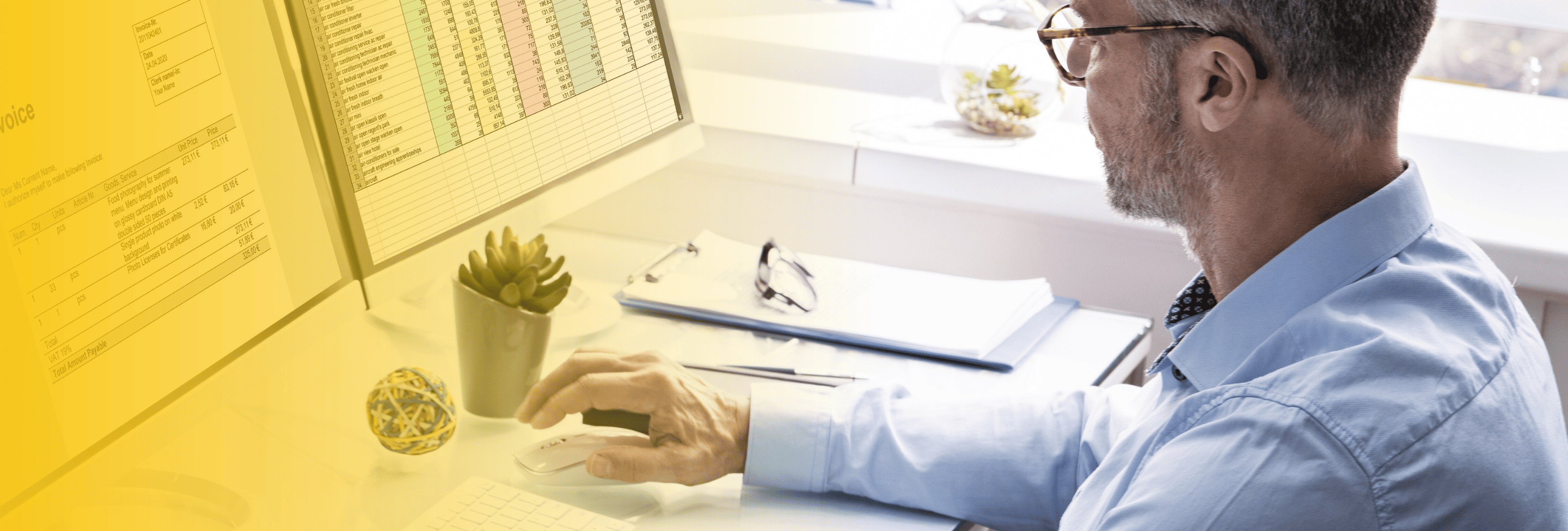 Man reviewing invoices and financial data on screen